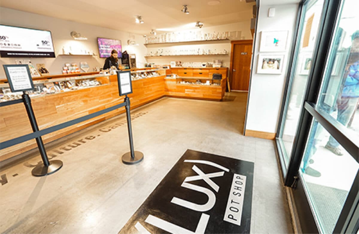 Front of cannabis store entrance with counters and products