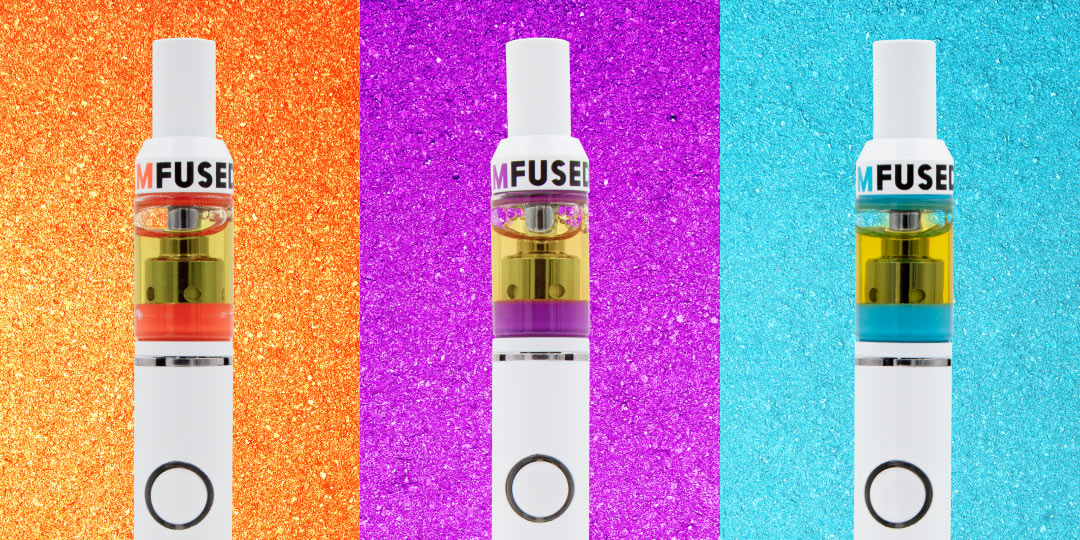 Three vape batteries topped with Mfused strain specific distillate cartridges, set side-by-side against different colored backgrounds