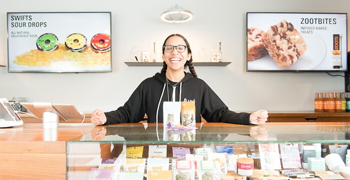 Lux Pot Shop Staff smiling at counter